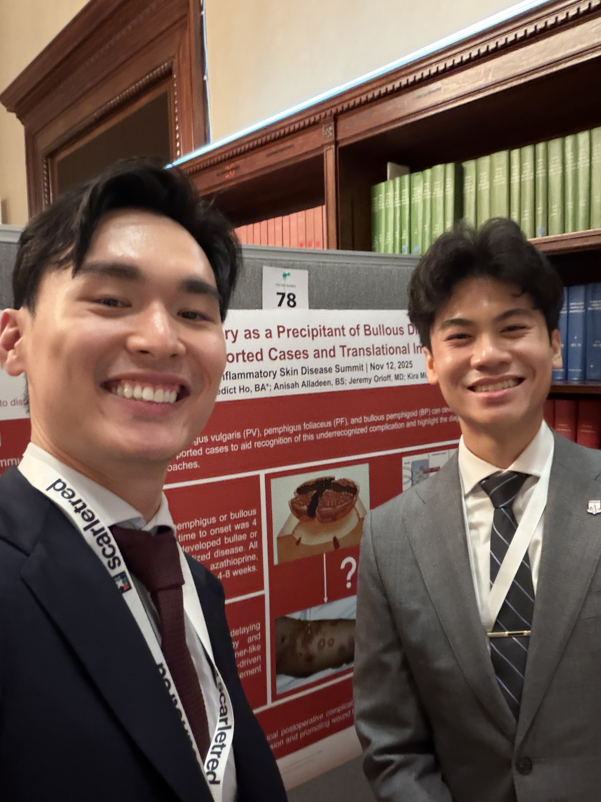 Lab members with poster presentation about Mohs surgery and bullous disease